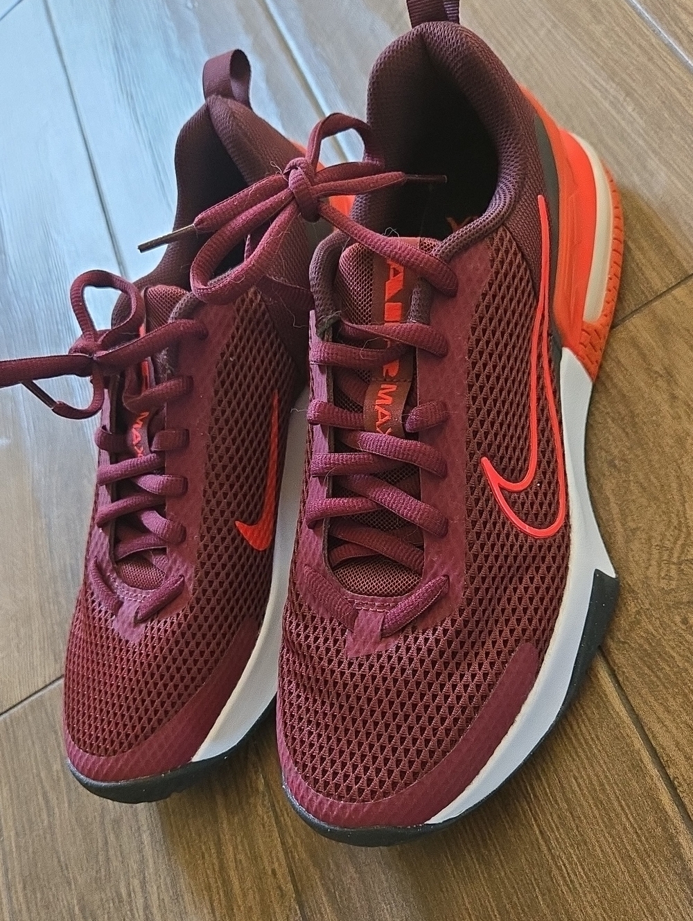 Nike Men's Burgundy Mesh Running Sneakers with Orange Swoosh